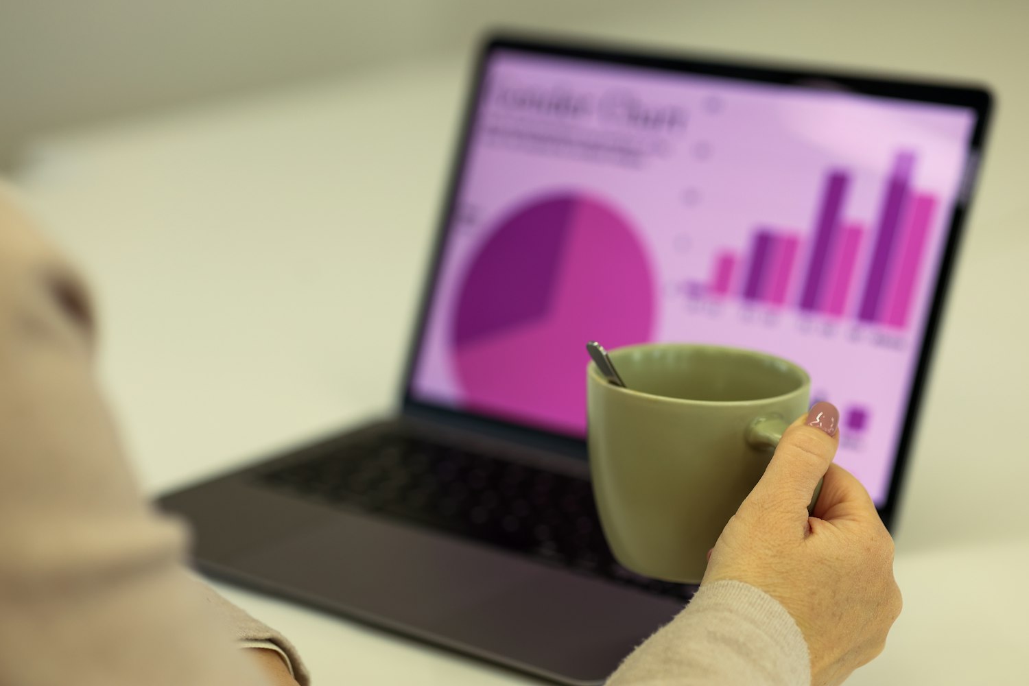 Reviewing support reporting charts on a laptop